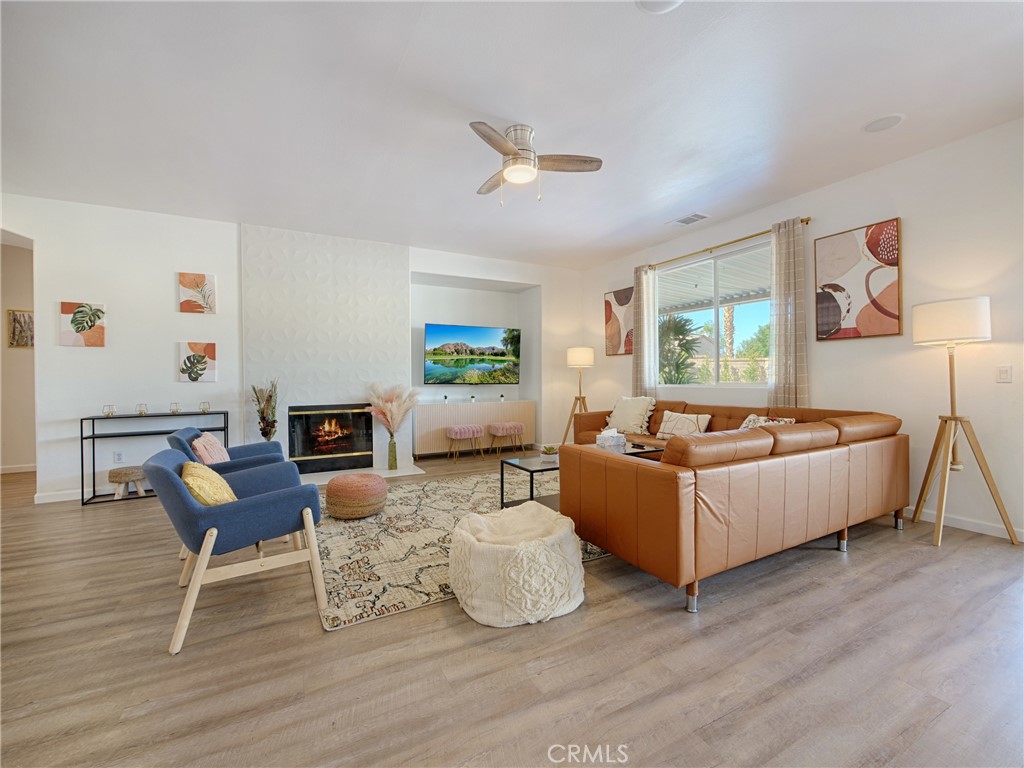 80718 Mountain Mesa Drive Indio, CA 92201 - Photo 6 of 47 a living room with furniture and a wooden floor