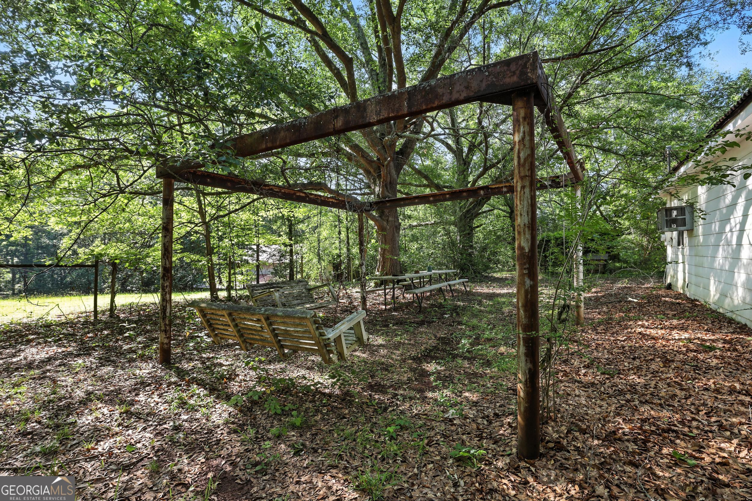1592 Black Mountain Road Toccoa, GA 30577 - Photo 12 of 30 a view of a yard with large trees
