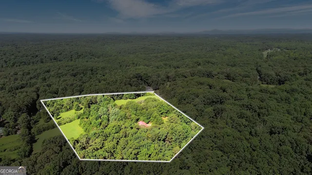 a view of a back yard from a balcony