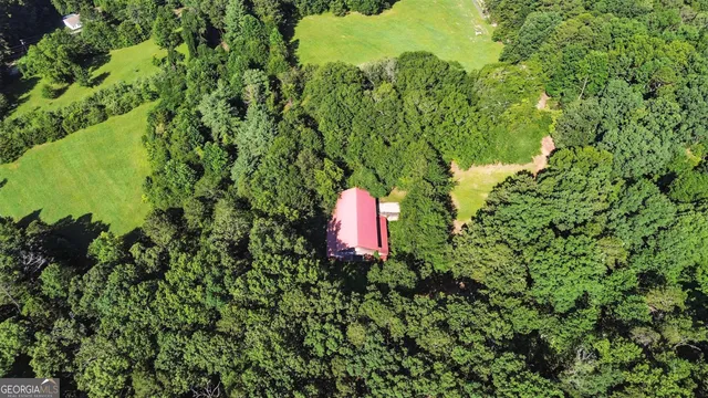 a backyard of a house with a yard and fountain