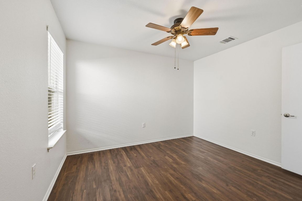 5813 Berryline Way Austin, TX 78724 - Photo 17 of 27 wooden floor in an empty room