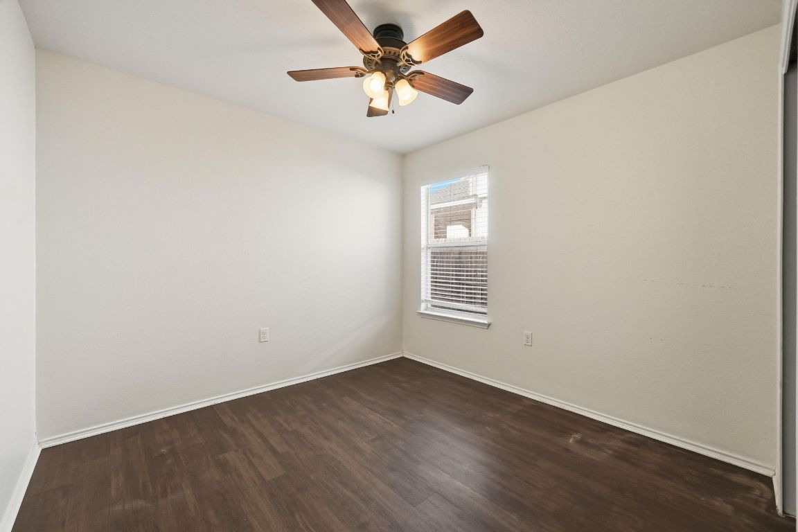 5813 Berryline Way Austin, TX 78724 - Photo 18 of 27 an empty room with a window and a fan