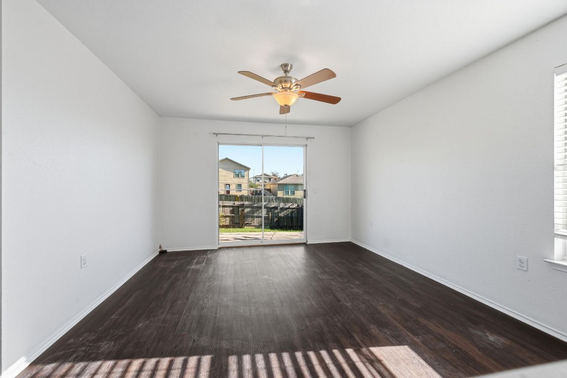 5813 Berryline Way Austin, TX 78724 - Photo 4 of 27 wooden floor in an empty room with a window