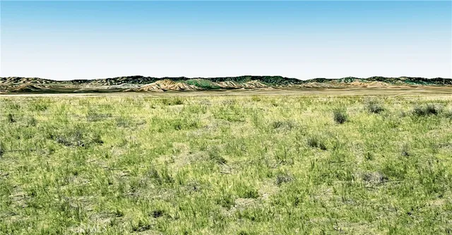 a view of a lake with houses in the back