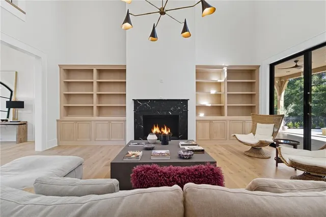 a living room with furniture fireplace and window
