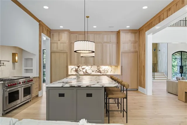 a spacious bedroom with a large bed and a large window