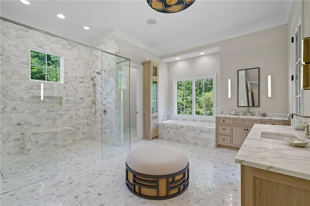 a large bed sitting in a bedroom next to a window