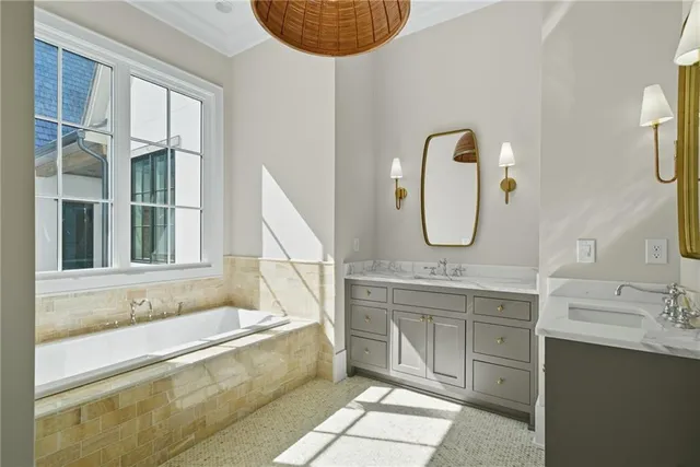 an empty room with windows and chandelier