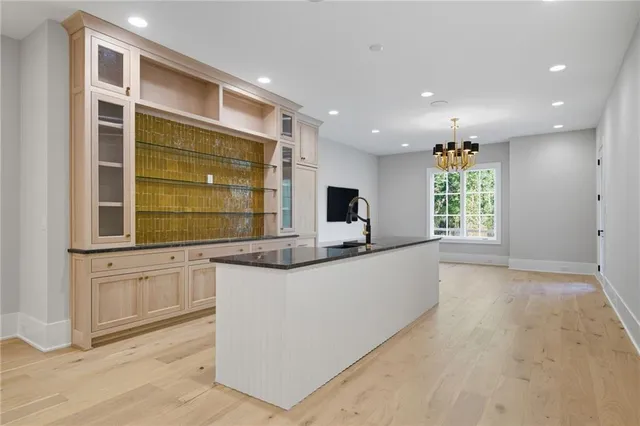 a front view of a house with a garden and yard