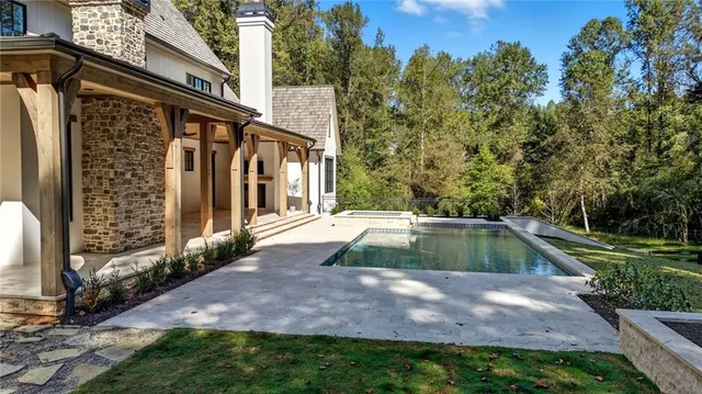 a view of a city with lush green forest