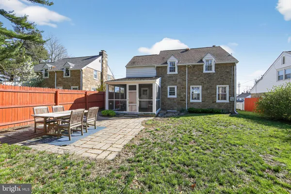 a brick building with a bench in front of it