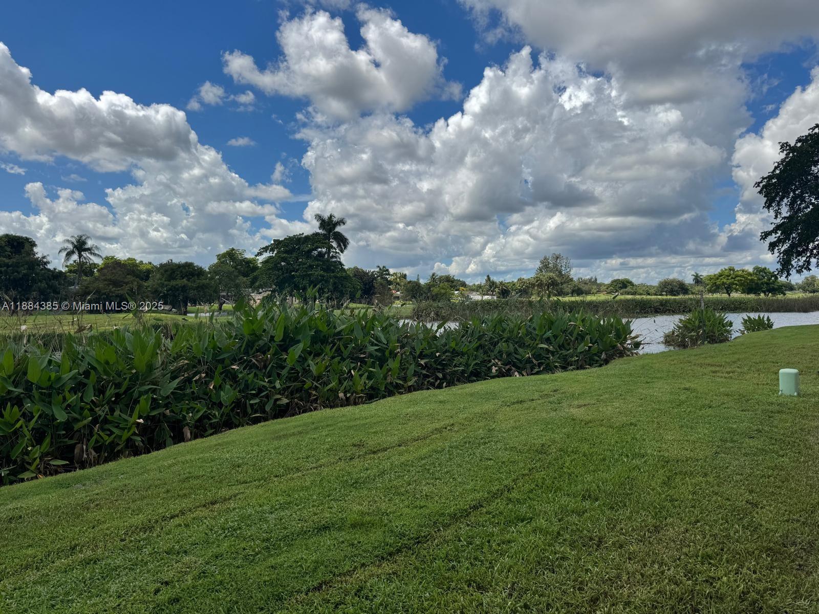 2471 Southwest 82nd Avenue, Unit 108 Davie, FL 33324 - Photo 1 of 14 a view of a city with lush green forest