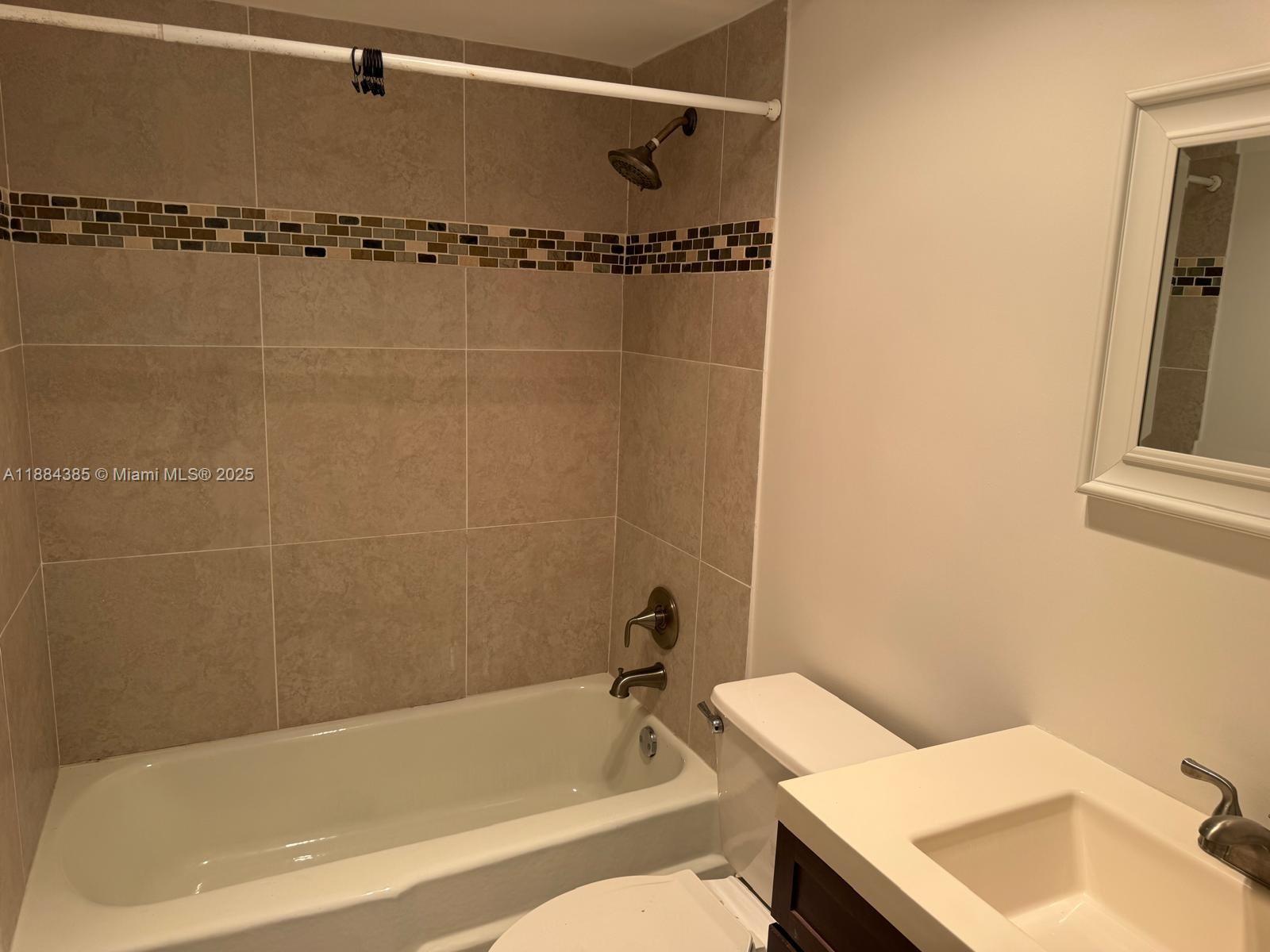 2471 Southwest 82nd Avenue, Unit 108 Davie, FL 33324 - Photo 11 of 14 a bathroom with a bathtub and shower
