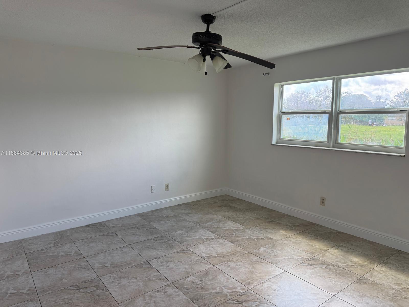 2471 Southwest 82nd Avenue, Unit 108 Davie, FL 33324 - Photo 9 of 14 a view of room with a window