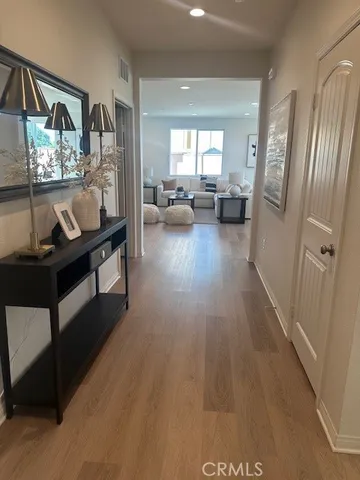 a view of a living room and hardwood floor