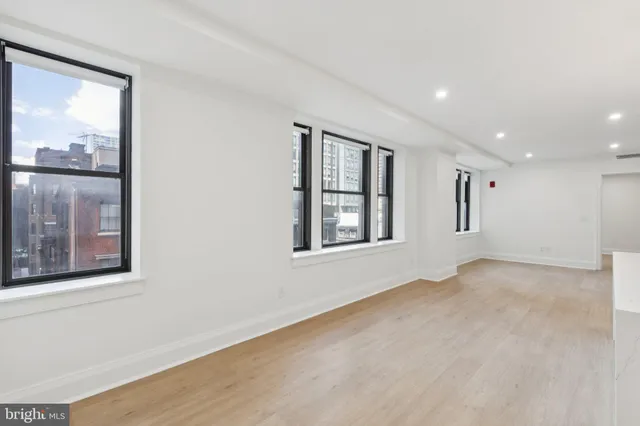 a view of an empty room with a window