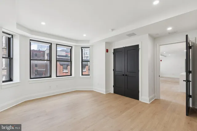 a view of an empty room with a window