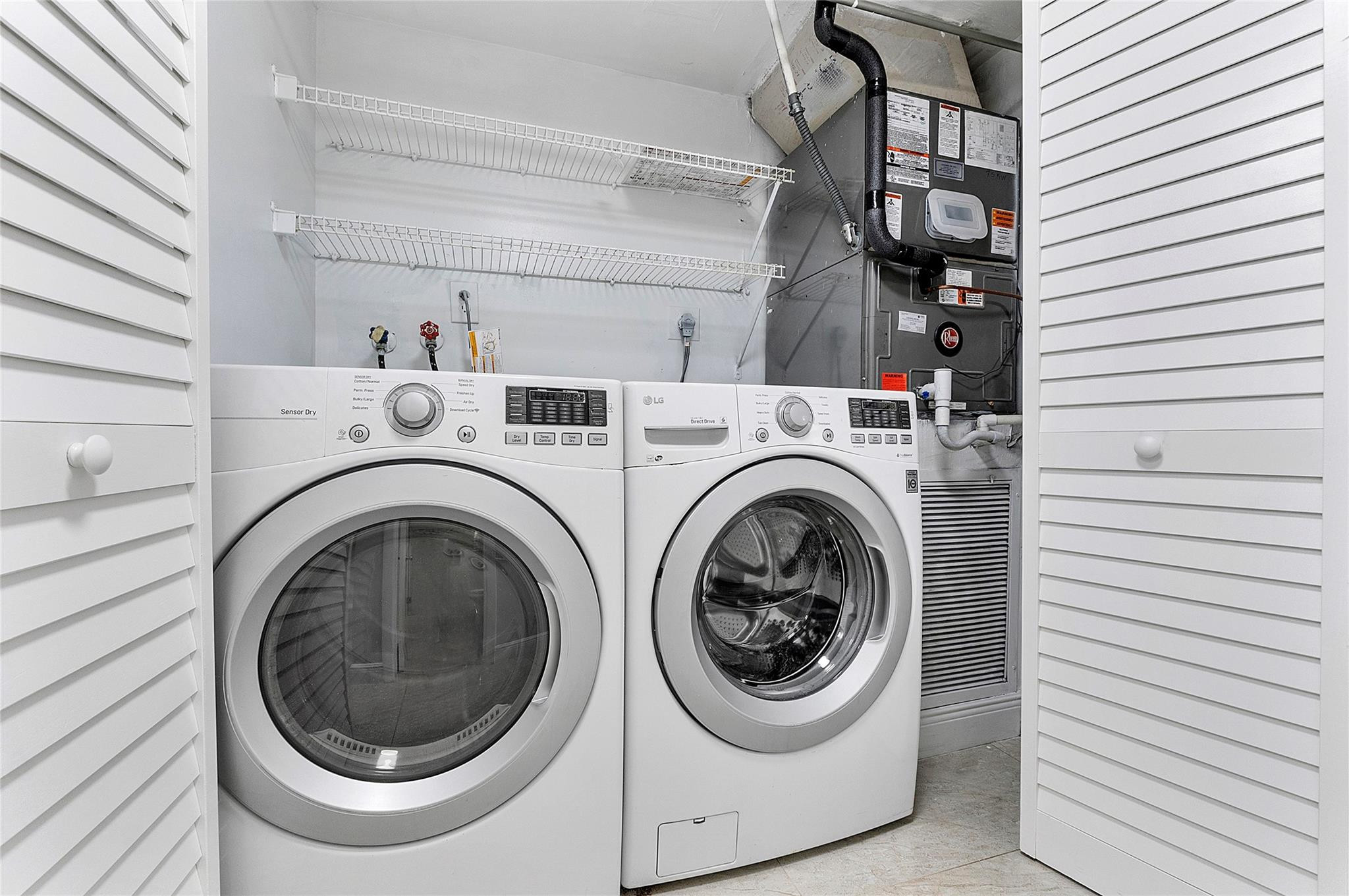 6593 Spring Bottom Way, Unit 237 Boca Raton, FL 33433 - Photo 16 of 49 a utility room with dryer and washer