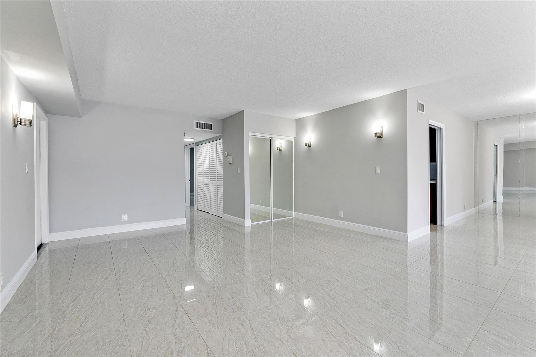 6593 Spring Bottom Way, Unit 237 Boca Raton, FL 33433 - Photo 18 of 49 a view of an empty room with wooden floor