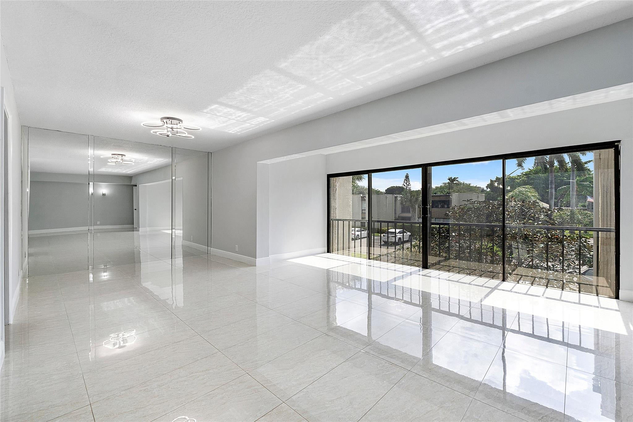 6593 Spring Bottom Way, Unit 237 Boca Raton, FL 33433 - Photo 2 of 49 a large white room with large windows