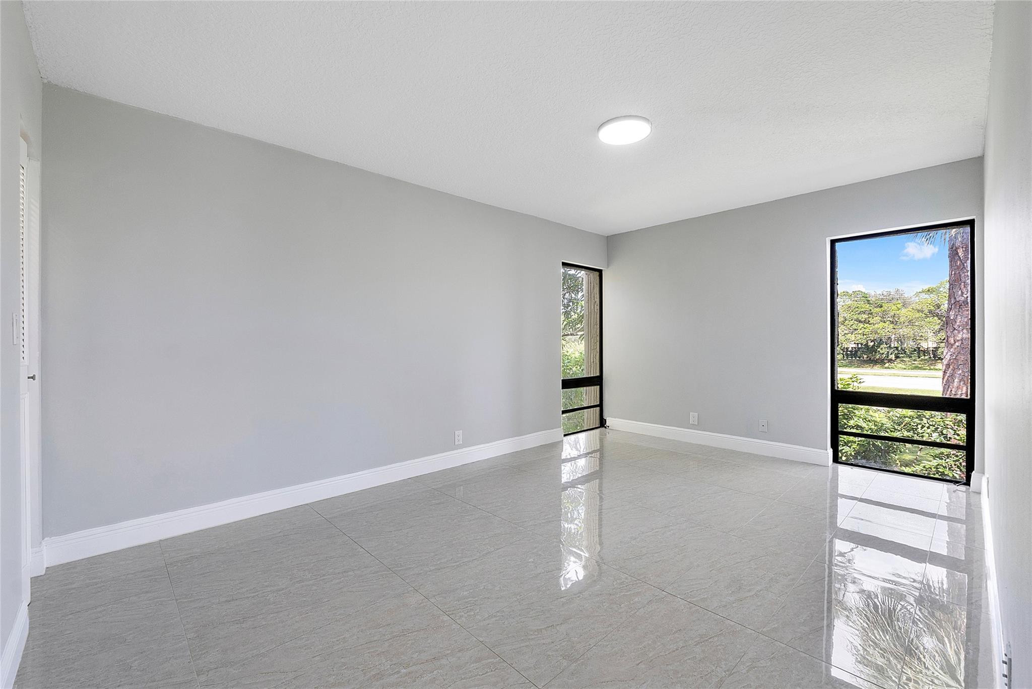 6593 Spring Bottom Way, Unit 237 Boca Raton, FL 33433 - Photo 22 of 49 wooden floor in an empty room with a window