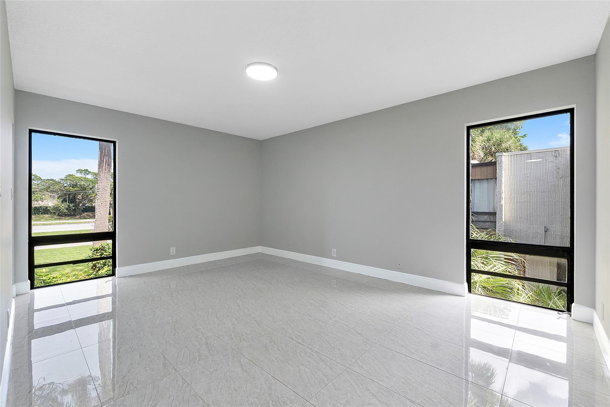 6593 Spring Bottom Way, Unit 237 Boca Raton, FL 33433 - Photo 23 of 49 an empty room with windows