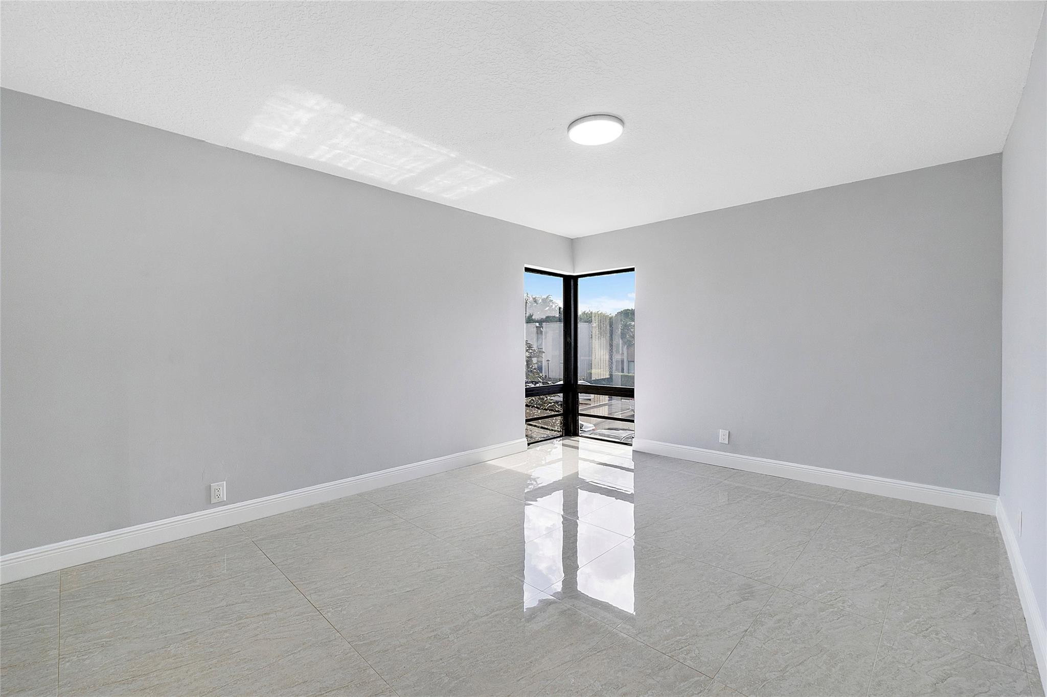 6593 Spring Bottom Way, Unit 237 Boca Raton, FL 33433 - Photo 26 of 49 wooden floor in an empty room with a window