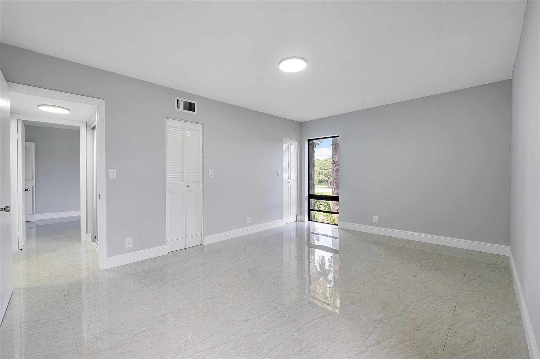 6593 Spring Bottom Way, Unit 237 Boca Raton, FL 33433 - Photo 31 of 49 wooden floor in an empty room