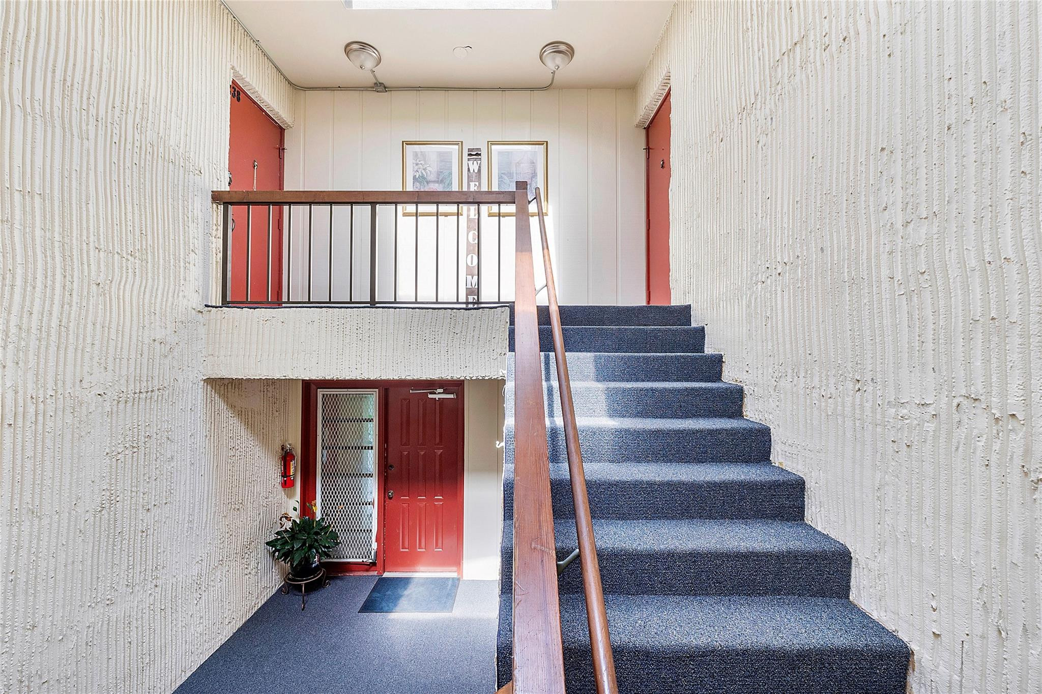 6593 Spring Bottom Way, Unit 237 Boca Raton, FL 33433 - Photo 38 of 49 a view of entryway with wooden floor and front door