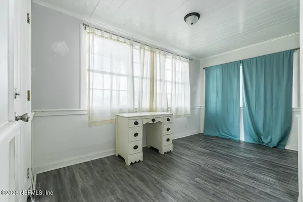 wooden floor and window in a room