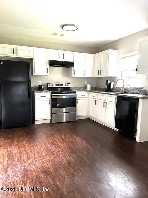 5620 Bagnal Road Jacksonville, FL 32205 - Photo 25 of 31 a kitchen with stainless steel appliances granite countertop a stove a sink and a refrigerator