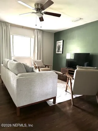 a living room with a couch and a flat screen tv
