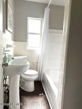 a bathroom with a toilet sink and a bathtub