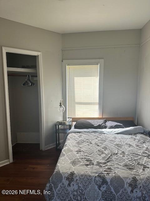 5620 Bagnal Road Jacksonville, FL 32205 - Photo 4 of 31 a bedroom with a bed and wooden floor