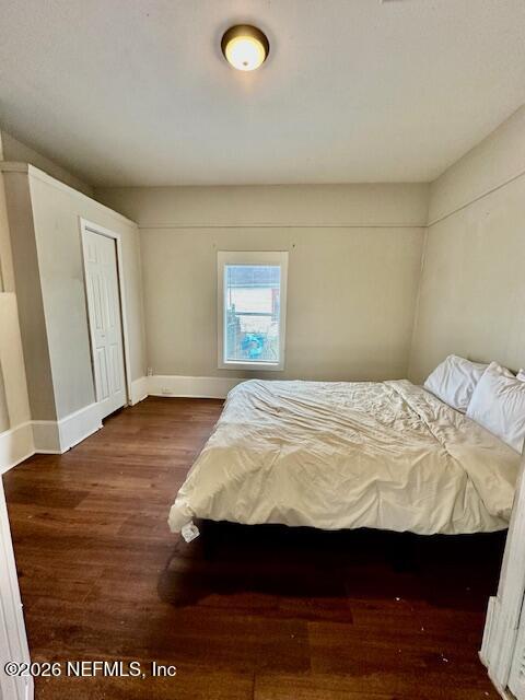 5620 Bagnal Road Jacksonville, FL 32205 - Photo 5 of 31 a bedroom with a bed and wooden floor