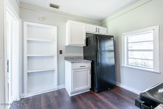 5620 Bagnal Road Jacksonville, FL 32205 - Photo 6 of 31 a kitchen with a refrigerator and wooden floor
