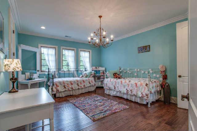 3137 McMillan Road Franklin, TN 37064 - Photo 11 of 20 a bed room with two beds and a chandelier