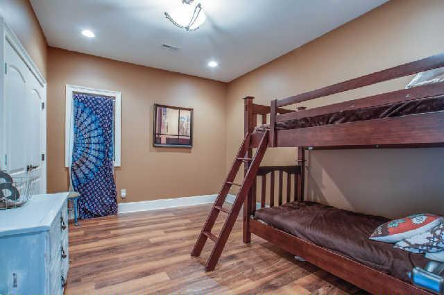 3137 McMillan Road Franklin, TN 37064 - Photo 16 of 20 a bedroom with a bed and wooden floor