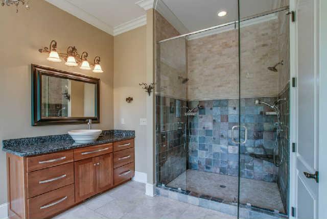 3137 McMillan Road Franklin, TN 37064 - Photo 8 of 20 a bathroom with a granite countertop sink mirror and shower