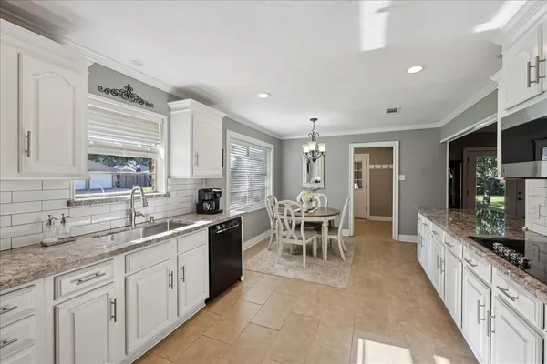 a large kitchen with cabinets