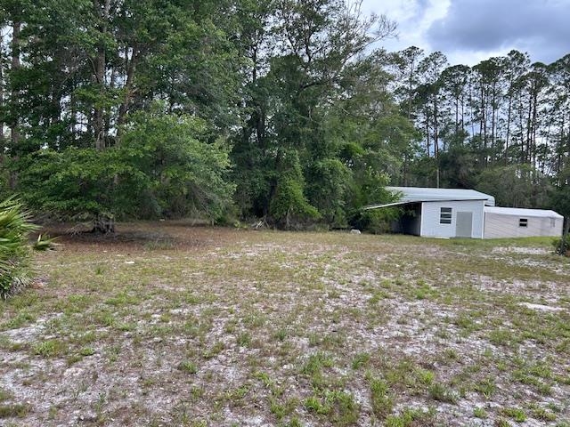 121 White Pine Georgetown, FL 32139 - Photo 13 of 42 a view of a barn in the middle of a yard