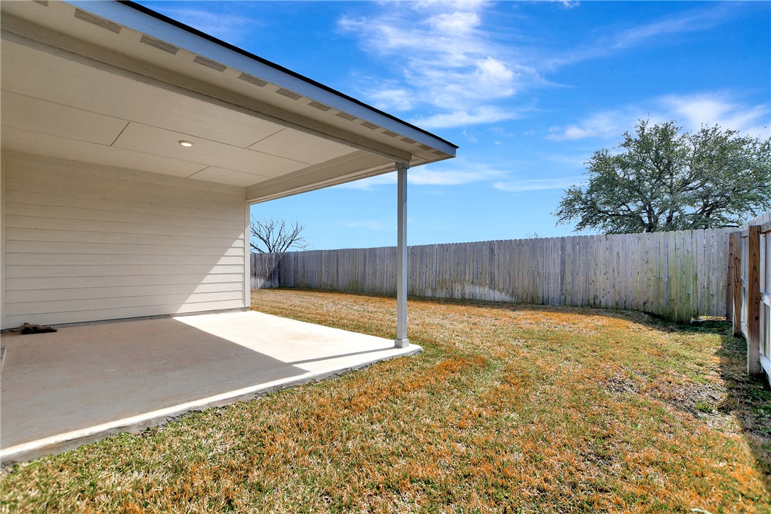 909 Davy Street Brenham, TX 77833 - Photo 27 of 35 Fenced backyard with a patio