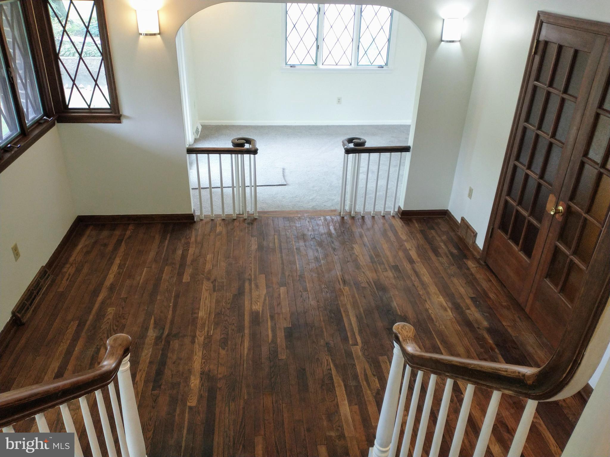 512 Mifflin Boulevard Reading, PA 19607 - Photo 17 of 57 a view of an empty room with wooden floor and a window