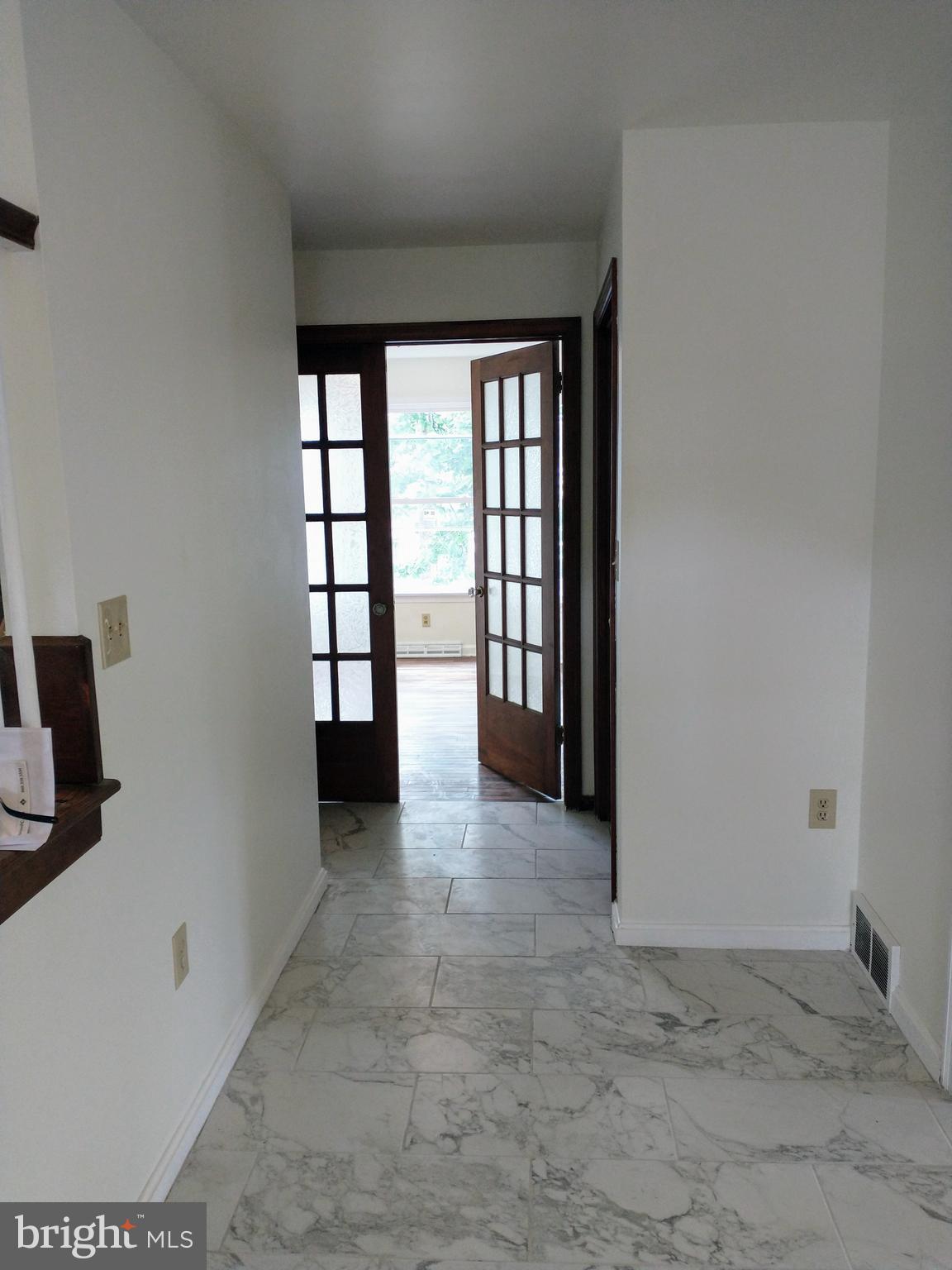 512 Mifflin Boulevard Reading, PA 19607 - Photo 21 of 57 wooden floor in an empty room with a window
