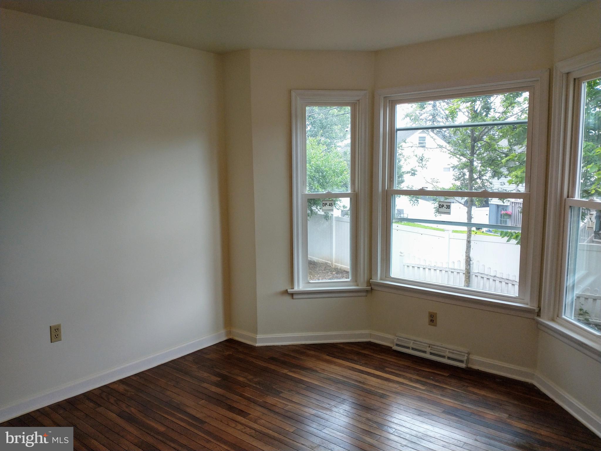 512 Mifflin Boulevard Reading, PA 19607 - Photo 24 of 57 an empty room with wooden floor and windows