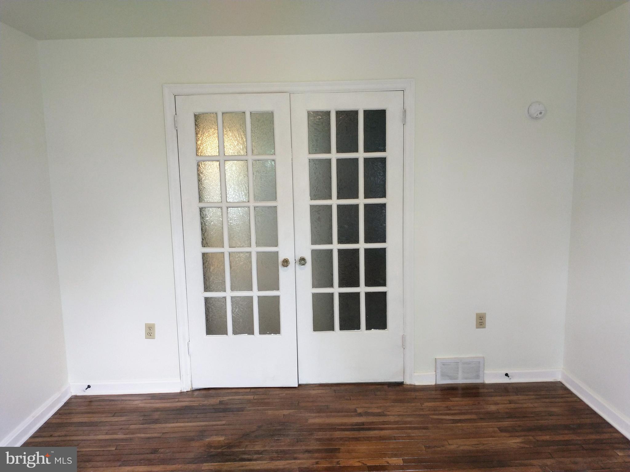 512 Mifflin Boulevard Reading, PA 19607 - Photo 26 of 57 a view of empty room with wooden floor and fan