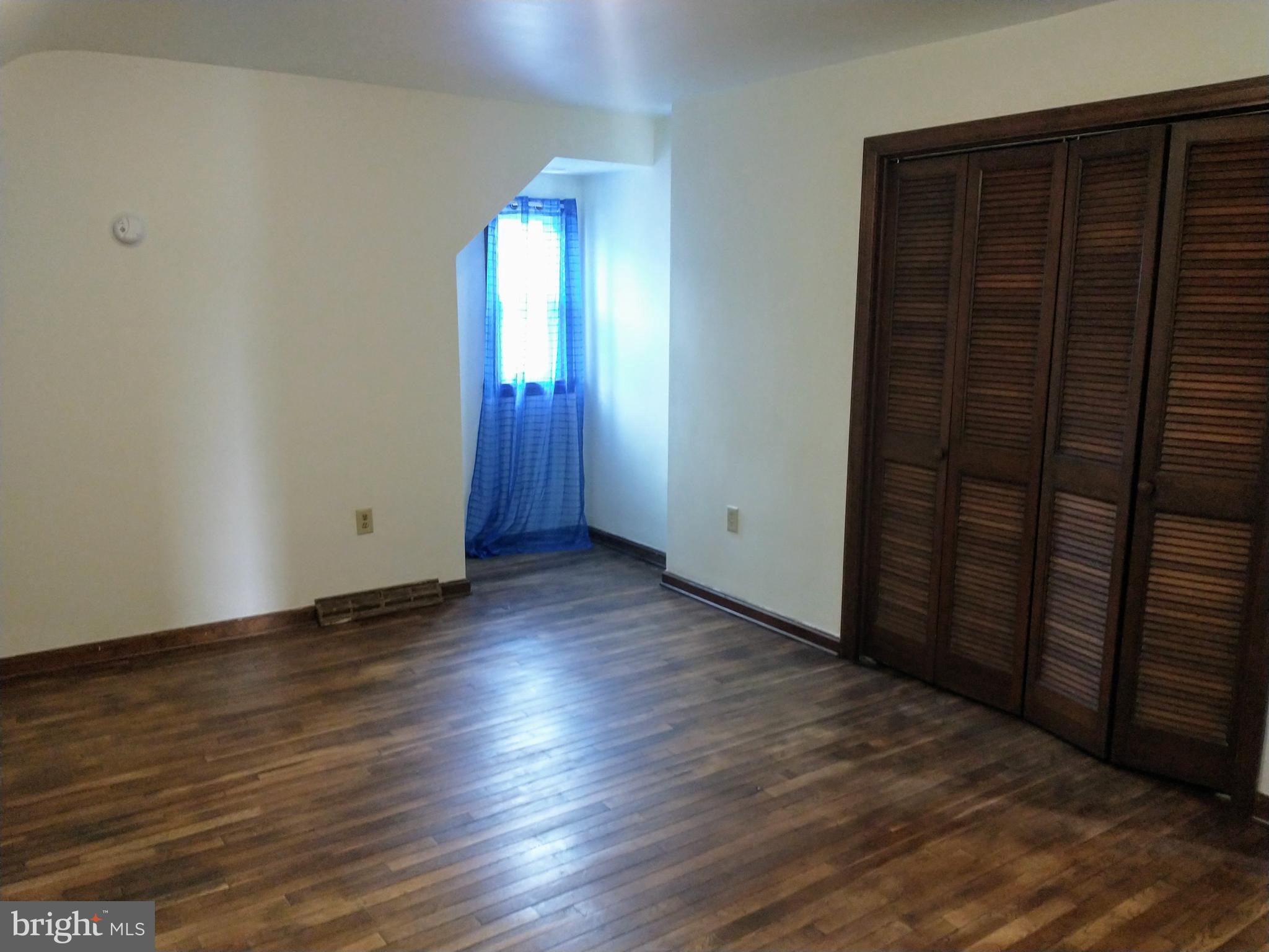 512 Mifflin Boulevard Reading, PA 19607 - Photo 28 of 57 an empty room with wooden floor and windows
