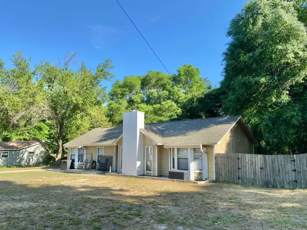 front view of a house with a big yard