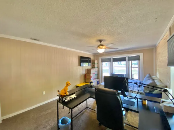 a bed room with a bed and furniture
