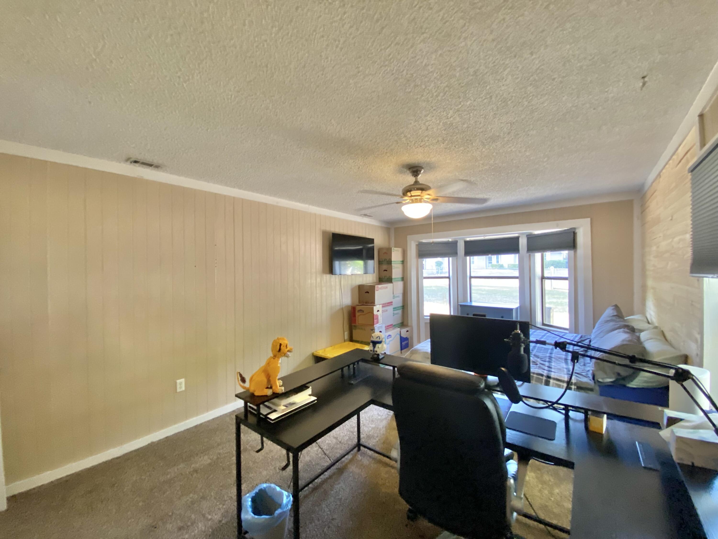 309 Springwood Circle Crestview, FL 32536 - Photo 23 of 44 a living room with furniture and a large window